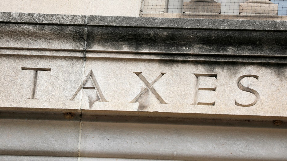 The word "taxes" on IRS headquarters building